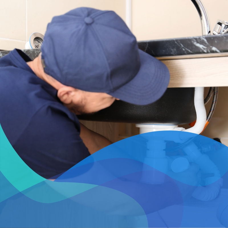 A skilled plumber in Abbotsford performing residential plumbing services, showcasing expertise in handling repairs such as leaky faucets and blocked drains issues.